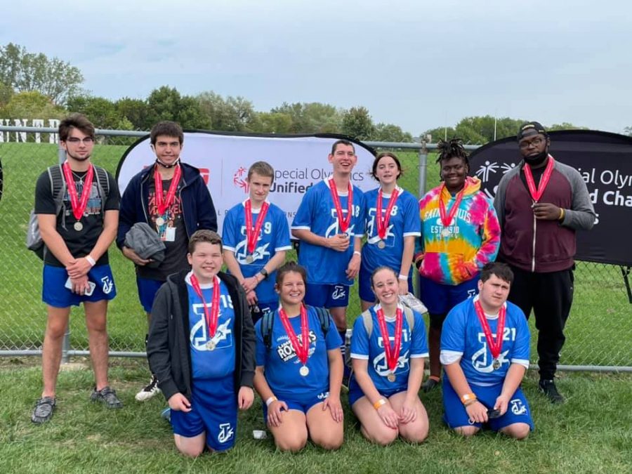 The Unified Soccer team displaying their silver hardware.  