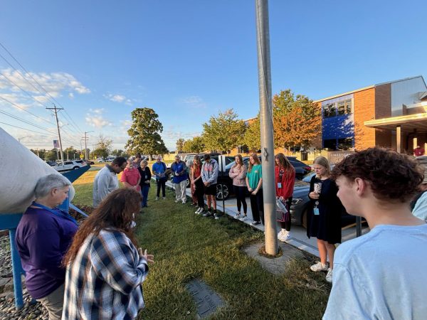 Students and faculty gather around the flag pole before school on Wednesday, September 25th.