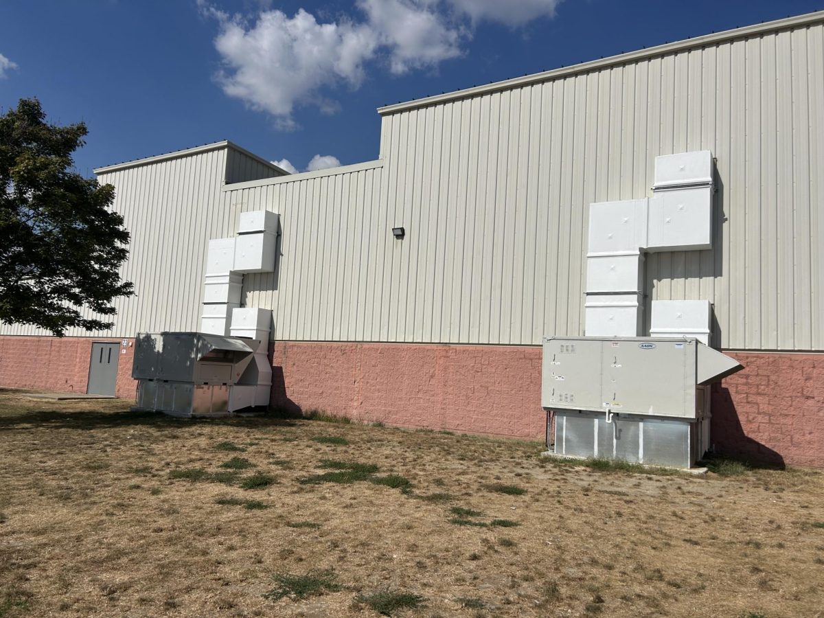 Auxilary gym air conditioning unit installation is complete.