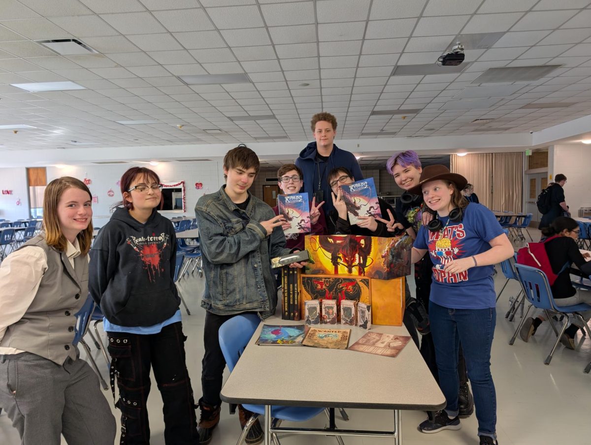 Games Club members pose with a recent donation.